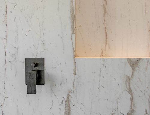 White marble shower with a niche